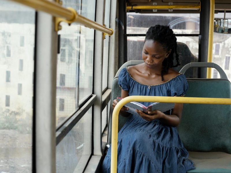 woman-reading-bus-medium-shot